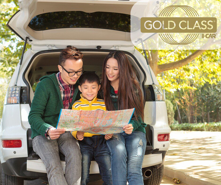 Family in SUV reading map outdoors