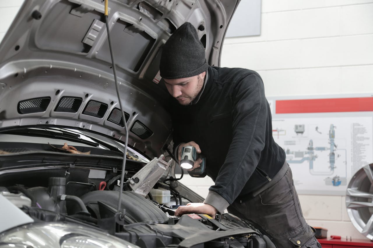 Skilled mechanic diagnosing vehicle problems