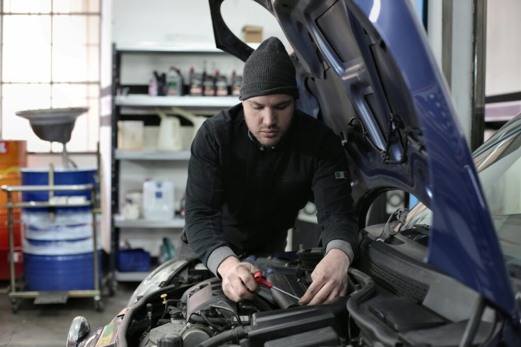Mechanic following OEM procedure during repair
